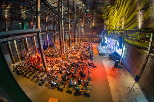 Phot of stage and audience at energy conference